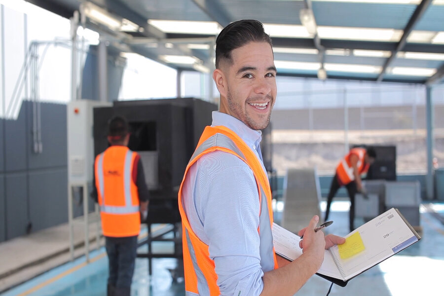 smiling standing employee manufacture support